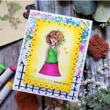 Flower-crown girl in a green top on a bright yellow-framed card, 'today just be that badass girl'.