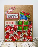 Kraft card with poinsettia paper and the gnome on green gifts under ''tis the season to be JOLLY'; the ho-ho-ho wording is from another set.