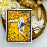 Orange spiderweb card of the ghost with silverware and heart dish nearby.