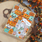 Pumpkin-collage gift box with the ghost and a hey-boo speech bubble.
