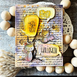 A layered Halloween card with peeking critters and a 'BOO' balloon over the dense trick-or-treat text background.