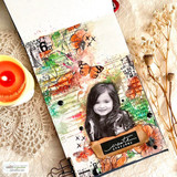 Mixed-media journal page with the floral newsprint background, a child's photo, and a 'create everyday' label