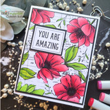 Red poppies on the newsprint grid background around a 'YOU ARE AMAZING' panel