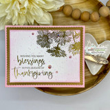 Card with muted asters and 'Wishing you many blessings in this season of thanksgiving.'