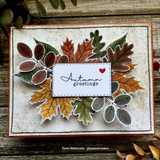 Card of a cluster of fall leaves on a distressed white panel, 'Autumn greetings.'