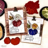 Two clipboard cards with pumpkins in a floral bouquet, shown with the red rubber stamps and ink pads