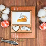 Rust patterned card with a watercolored pie slice topped with whipped cream, a stitched heart and a 'keep your FORK there's PIE' banner
