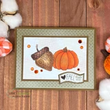 Polka dot framed card with a brown acorn and an orange pumpkin side by side and a 'FALL that's all' banner