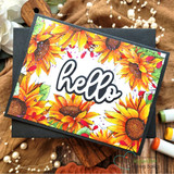 Angie Blom's lush sunflower border framing a card edge to edge, a red rubber background stamp shown on a bright fall card.