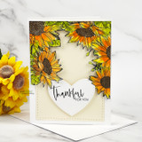 Angie Blom's lush sunflower border framing a card edge to edge, a red rubber background stamp shown on a bright fall card.