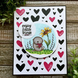 A baby otter clutches a daisy with 'enjoy the little things,' a petite itty bitty red rubber stamp shown on a handmade card.