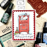 Card with a red mailbox on a scalloped frame, 'Making spirits bright.'