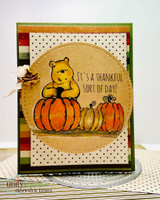 Fall card with a scalloped circle die framing a stamped pumpkin and 'it's a thankful sort of day'