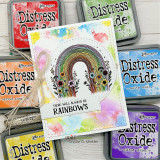 Card with a rainbow inside a scalloped circle die and 'we can all use a little more rainbows'