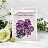 Card with purple flowers in a scalloped circle die and 'we cannot thank you enough'