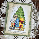 Winnie the Pooh and Christopher Robin read together by a Christmas tree with 'I can already feel the Merry,' a red rubber holiday stamp on a card.