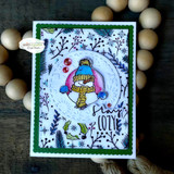 Green framed card with the winter foliage background stamped around a hand colored snowman in a striped hat and scarf.