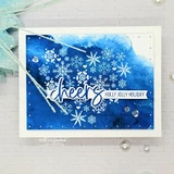 Card of white snowflakes scattered on a deep navy panel with 'cheers' and 'holly jolly holiday'.