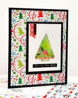 Framed card of a single decorated tree on holiday papers, 'feliz navidad.'