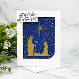 Card with the gold nativity die on navy stars, 'All is Calm all is Bright'