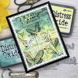 Green distress card with a butterfly over the ledger, 'happy birthday.'