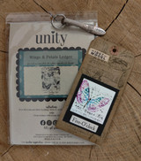 Packaged Wings & Petals Ledger stamp with a small butterfly card.