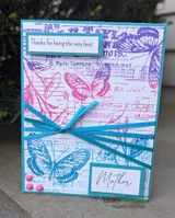 Bright card with butterflies over the ledger, 'Thanks for being the very best. Mother.'