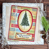 Card of a pine tree in an oval frame over a word-strip background, 'May this season be filled with abundant joy.'