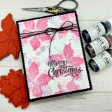 Pink poinsettia print on a black-framed card, 'Merry Christmas'.