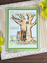The tree in soft greens on a white panel with a green frame, with "I love you."