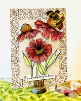 Tall card with a leafy stamped background and red-orange coneflowers with a bee, over “It's a beautiful day to dream.”