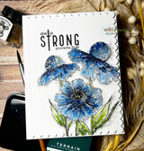 Handmade card with blue coneflowers and daisies beneath the stamped 'she is strong, Proverbs 31:25' verse.