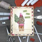 Card of the tree-carrying girl with 'holly jolly holidays.'