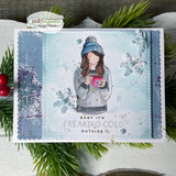 Card of the beanie girl in a gray hat over a soft winter panel with pinecones.