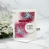 Soft white card with the snowflake in pink and a circle 'warm wishes,' with baby's breath.