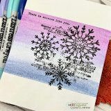 Ombre pink-to-blue card with the snowflake stamped in black, 'there is magic in the air when it snows.'