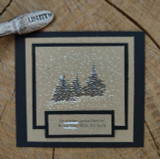 Snowy pine trees stamped on kraft, 'No winter lasts forever, no spring skips its turn.'