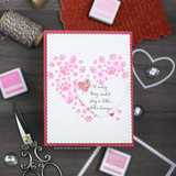 Card with paw prints arranged in a pink heart shape, "if only they could stay a little while longer," pink ink pads nearby