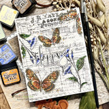 Cake stamp on a vintage butterfly-collage card, 'Happy Birthday'.
