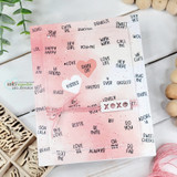 Pink card with the chatty-word background stamped all over and a knotted bow across the front.