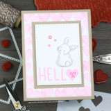 Soft pink hearts stencil background with a little bunny and a heart sentiment.