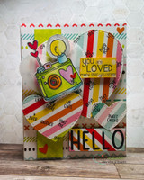 Retro camera over a red-striped and hearts background with a 'you are loved' and 'HELLO' shown.