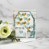 Tag-style card with soft gold hearts stenciled and a 'HAPPY FOR YOU' sentiment.
