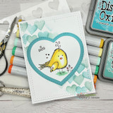 Teal card with a cheerful bird inside an open heart on the stenciled hearts background.