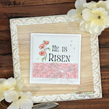 Wood-framed card with a coral floral panel, sentiment 'HE IS RISEN' beside coral poppies, tied with a sheer pink ribbon.