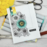 Card with the outline zinnia bouquet colored in soft teal and grey beside marker pens and a 'HELLO' tab.