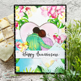 Card with the couple within a floral-framed heart and 'Happy Anniversary.'