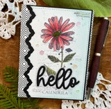 Handmade card made with Unity Stamp Co’s Joy In Your Dreams red rubber stamp set — a tall calendula flower with a botanical label, a butterfly and mixed-media text collage — stamped and colored, with the sentiment “Dream big”.
