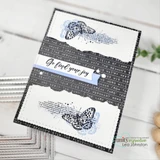 Handmade card made with Unity Stamp Co’s Joy In Your Dreams red rubber stamp set — a tall calendula flower with a botanical label, a butterfly and mixed-media text collage — stamped and colored, with the sentiment “Dream big”.