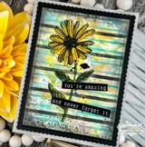 Handmade card made with Unity Stamp Co’s Joy In Your Dreams red rubber stamp set — a tall calendula flower with a botanical label, a butterfly and mixed-media text collage — stamped and colored, with the sentiment “Dream big”.